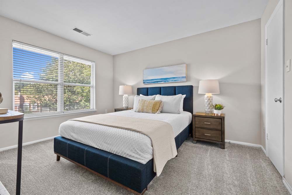 Bedroom with windows at Runaway Bay Apartments in Virginia Beach, Virginia