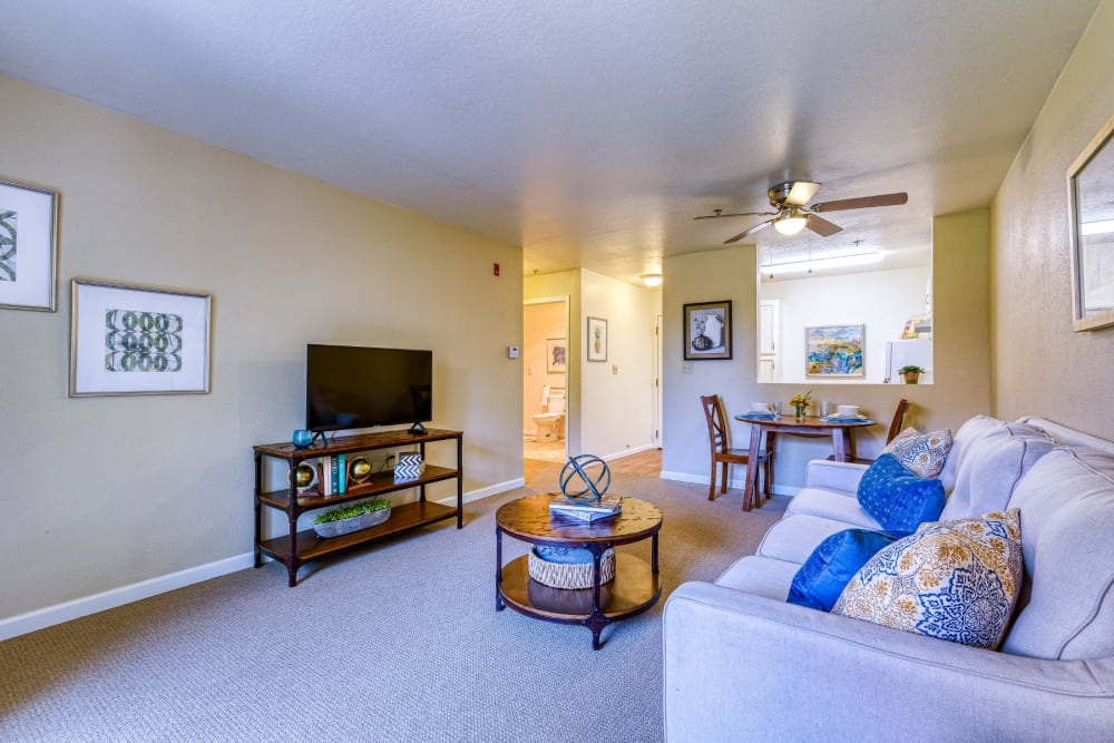 Resident living room with coffee table and television at Pacifica Senior Living Fresno in Fresno, California