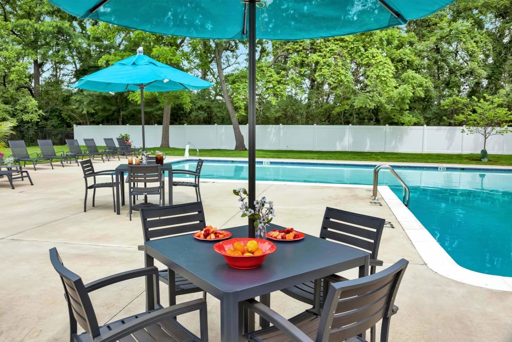 Sparkling pool with lounge chairs and umbrella at Valley Park, Bethlehem, Pennsylvania