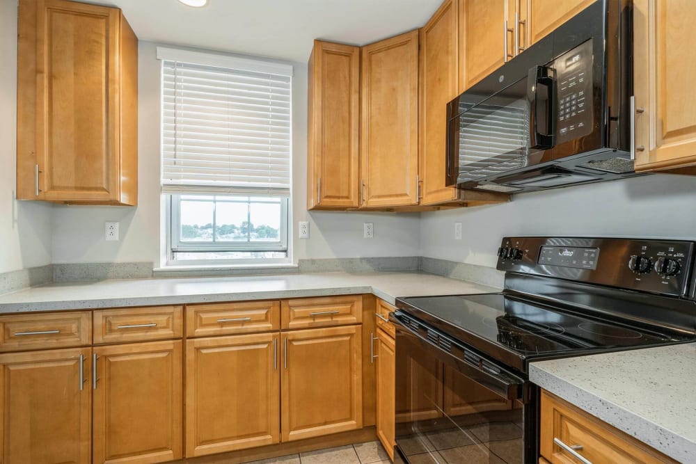 Kitchen with black appliances at Parc at Lyndhurst in Lyndhurst, New Jersey