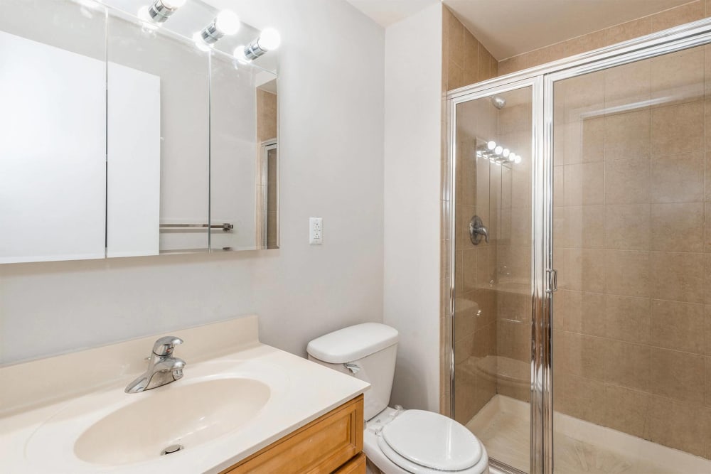 Bathroom with glass shower door at Parc at Lyndhurst in Lyndhurst, New Jersey