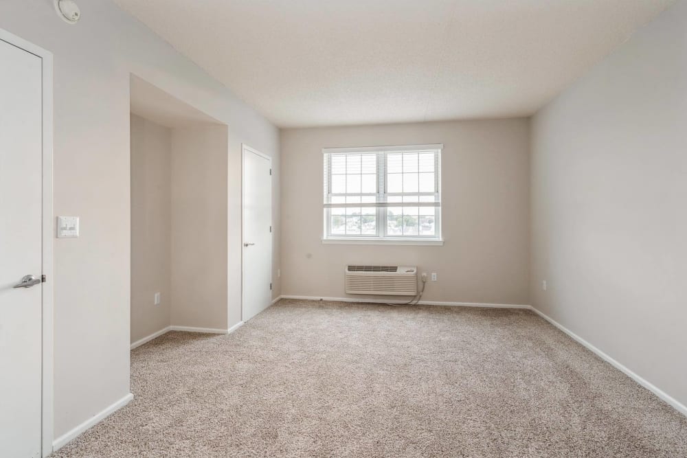 Carpeted bedroom with large window at Parc at Lyndhurst in Lyndhurst, New Jersey
