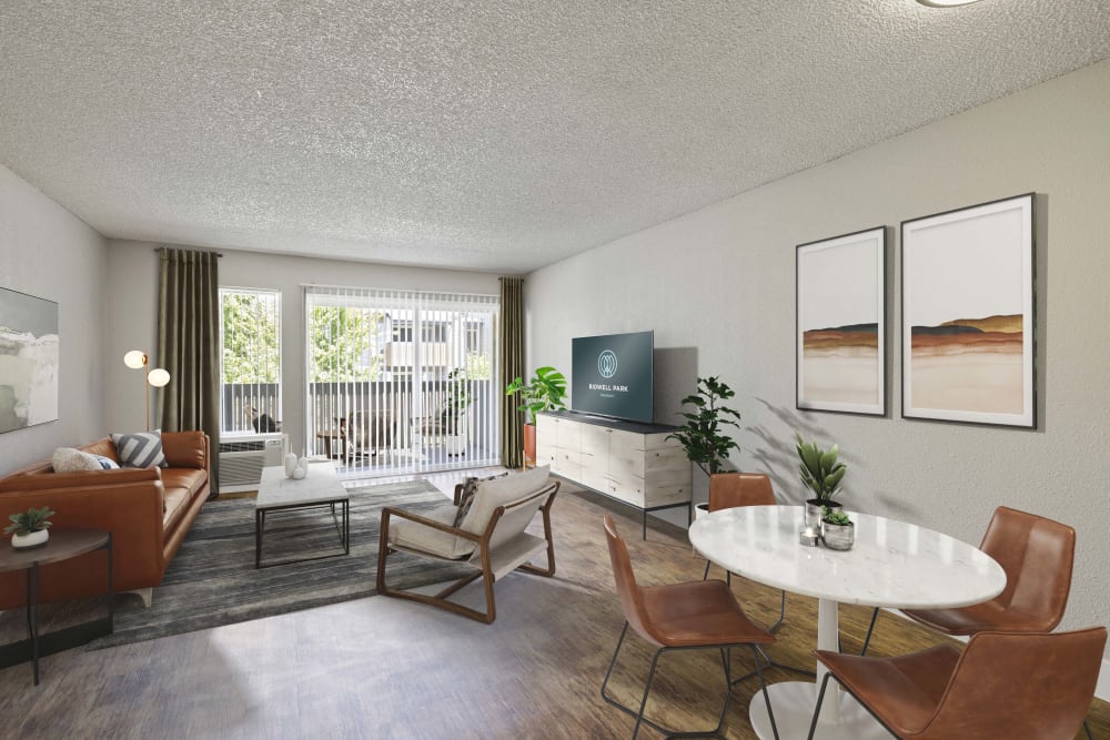 Spacious move-in ready living room with hardwood style flooring at Bidwell Park Fremont in Fremont, California