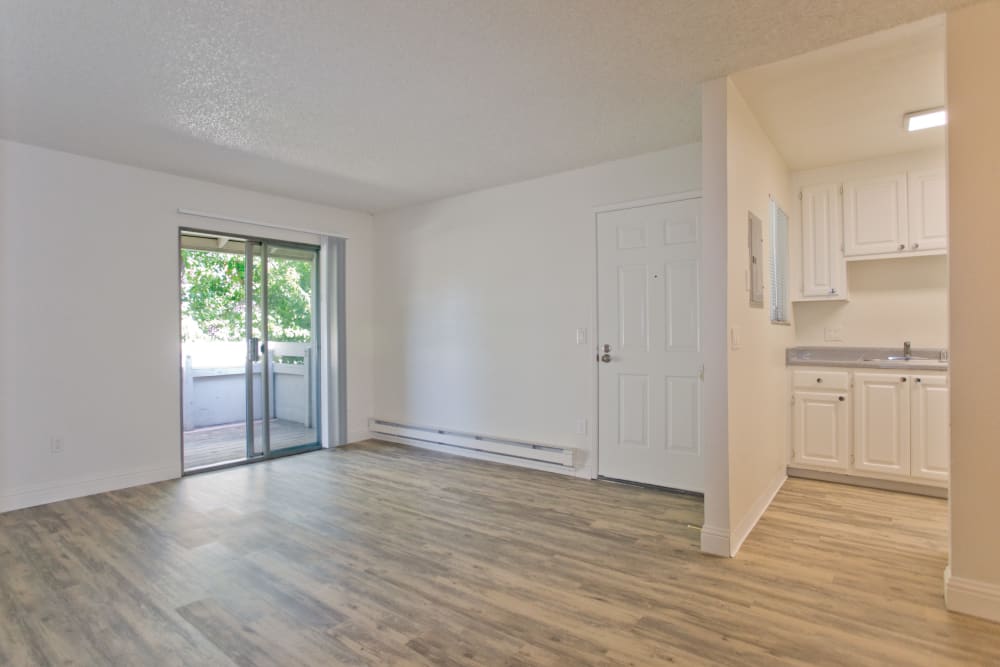 Empty apartment unit with hardwood floors at Trinity Way in Fremont, California