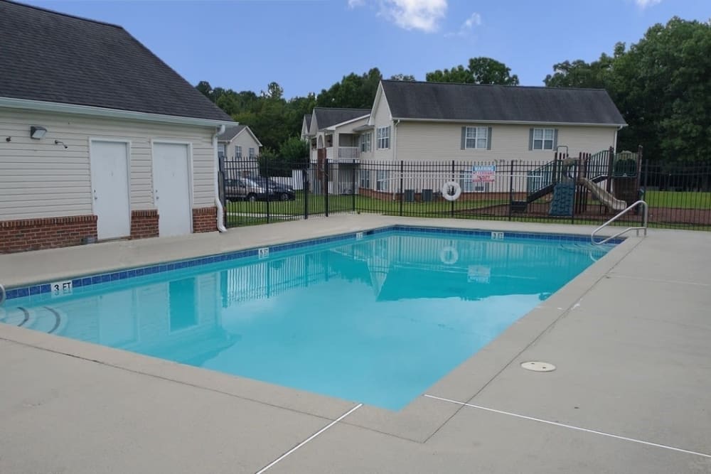 Crystal clear swimming pool at The Cove at Cloud Springs Apartment Homes in Fort Oglethorpe, Georgia