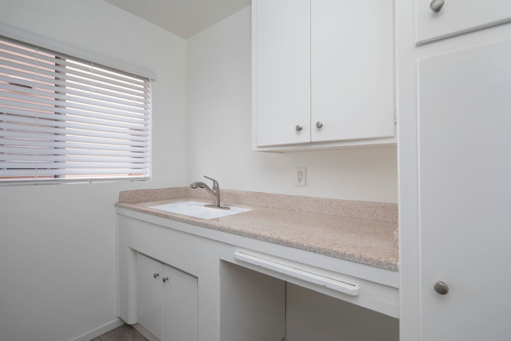 All white kitchen at Emerald Manor Apartments in San Diego, California
