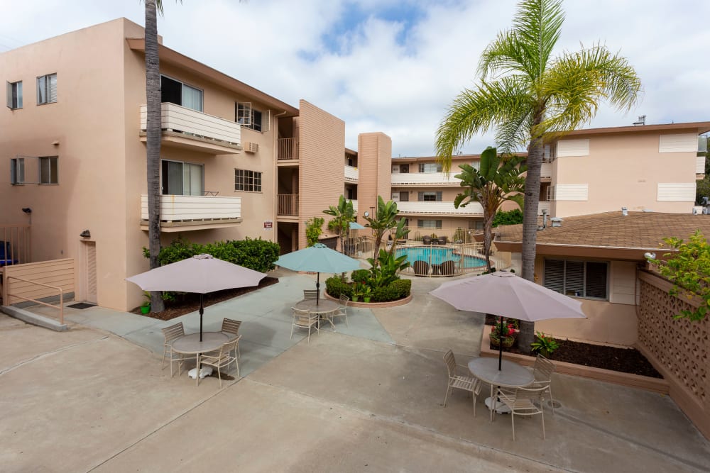 Palm tree lined courtyard at Emerald Manor Apartments in San Diego, California