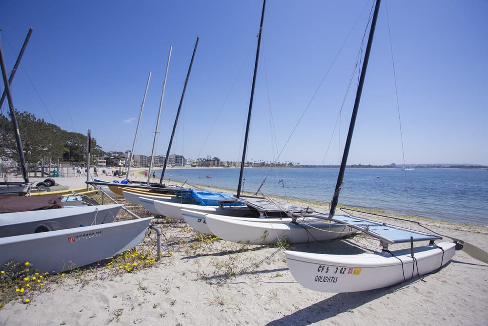 Sailboats on beach near Sail Bay Apartments in San Diego, California