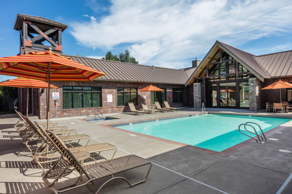 Swimming pool and lounge chairs in the daylight at Avery at Orenco Station in Hillsboro, Oregon