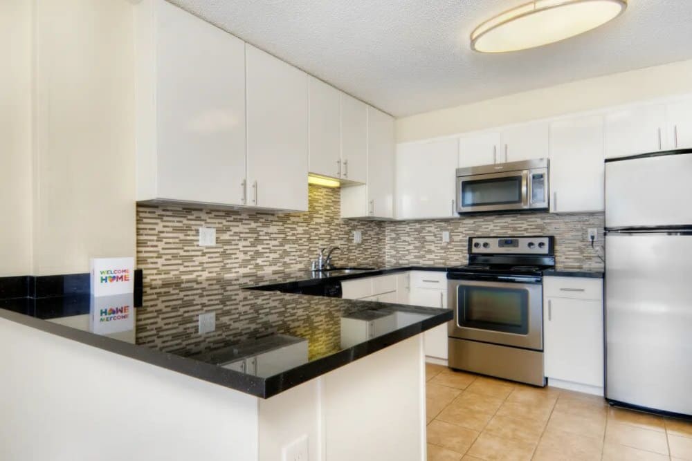Kitchen with granite countertops at Skyline Terrace Apartments in Burlingame, California