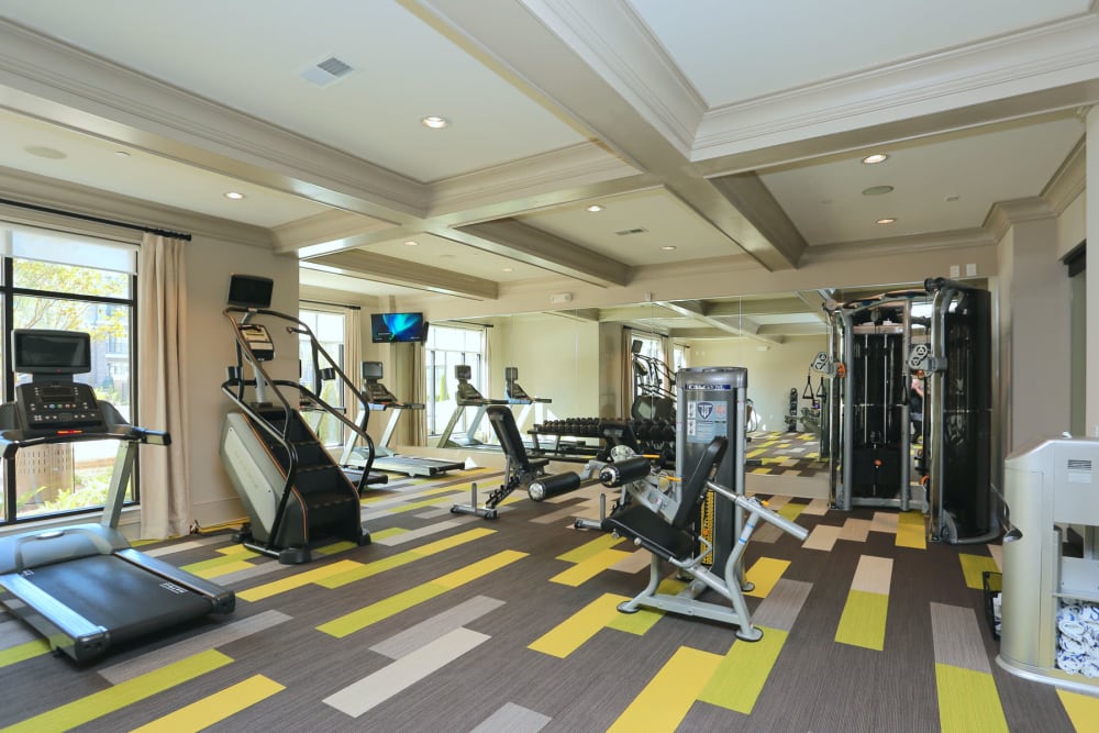 Exercise machines and strength training equipment in the fitness center at 2370 Main at Sugarloaf in Duluth, Georgia