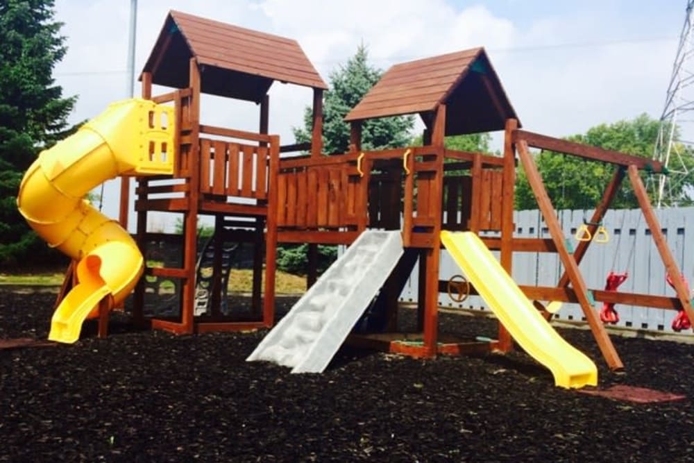 Children's playground with slides at Meridian Oaks Apartments in Greenwood, Indiana