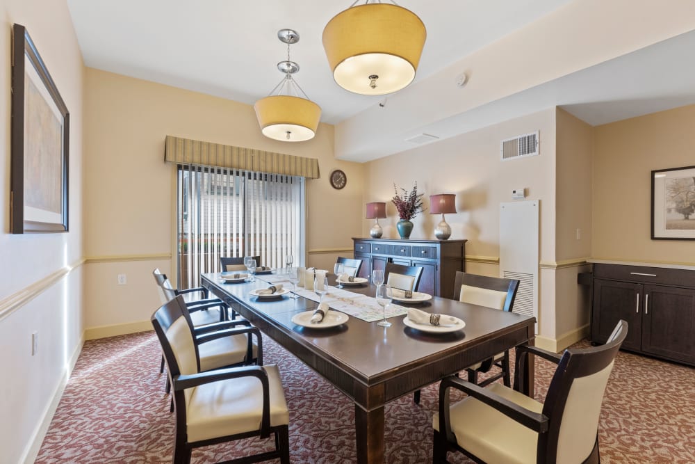 Large dining room table with plenty of seating at Pacifica Senior Living Burlingame in Burlingame, California