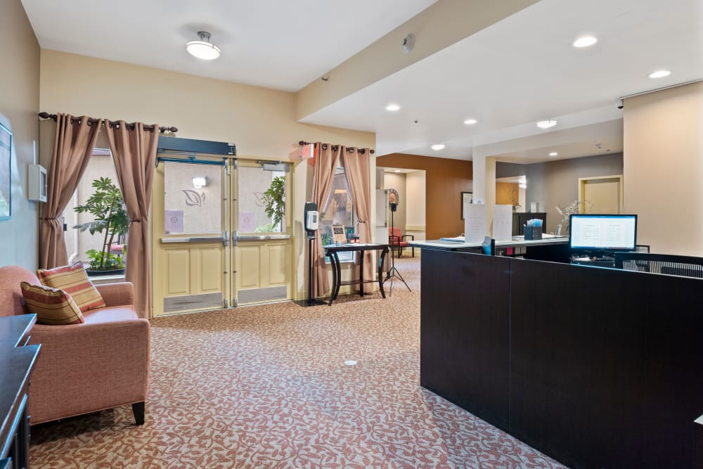 Reception area with seating at Pacifica Senior Living Burlingame in Burlingame, California