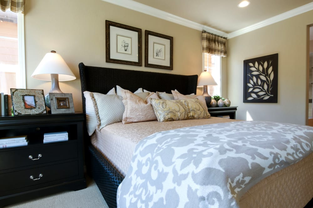 A beautifully decorated bedroom at Heritage Meadows Gracious Retirement Living in Cambridge, Ontario