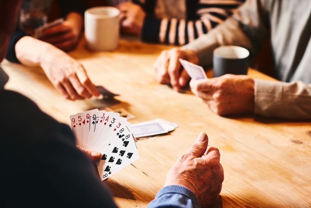 Residents playing cards together at Victoria Park Personal Care Community in Regina, Saskatchewan