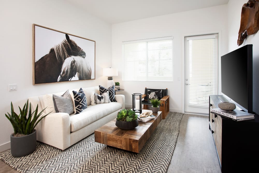 Model living space with natural lighting at The Residences at Escaya in Chula Vista, California