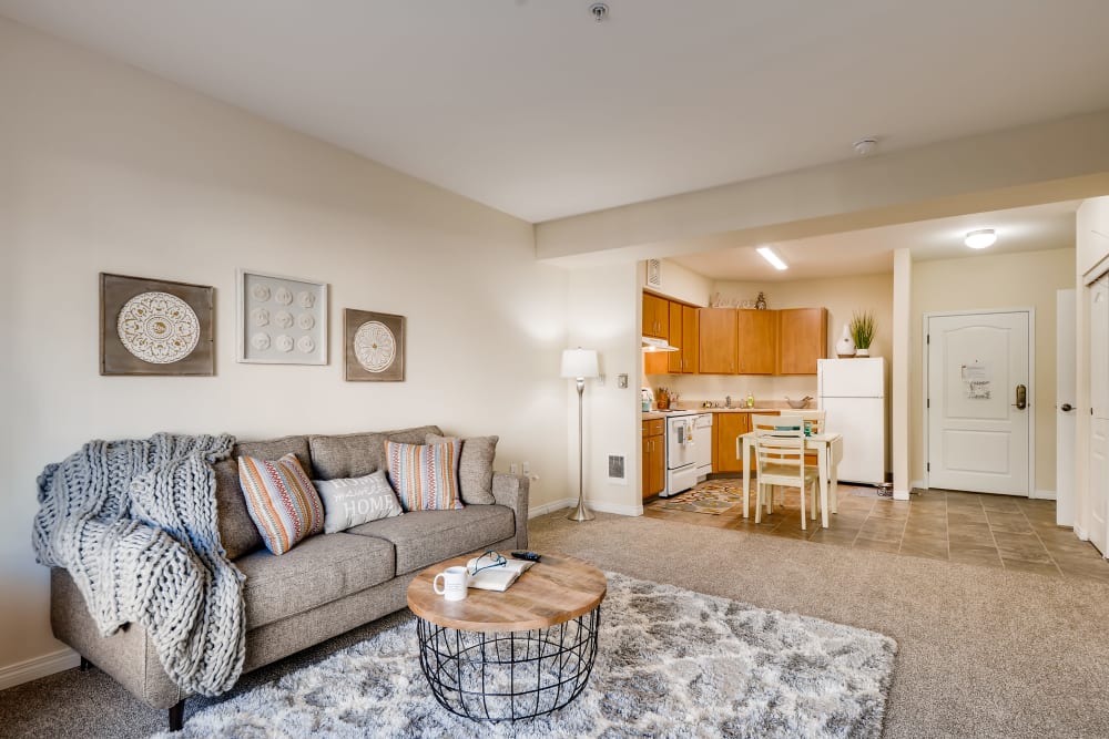 Senior apartment living room and kitchen at Vancouver Pointe in Vancouver, Washington.