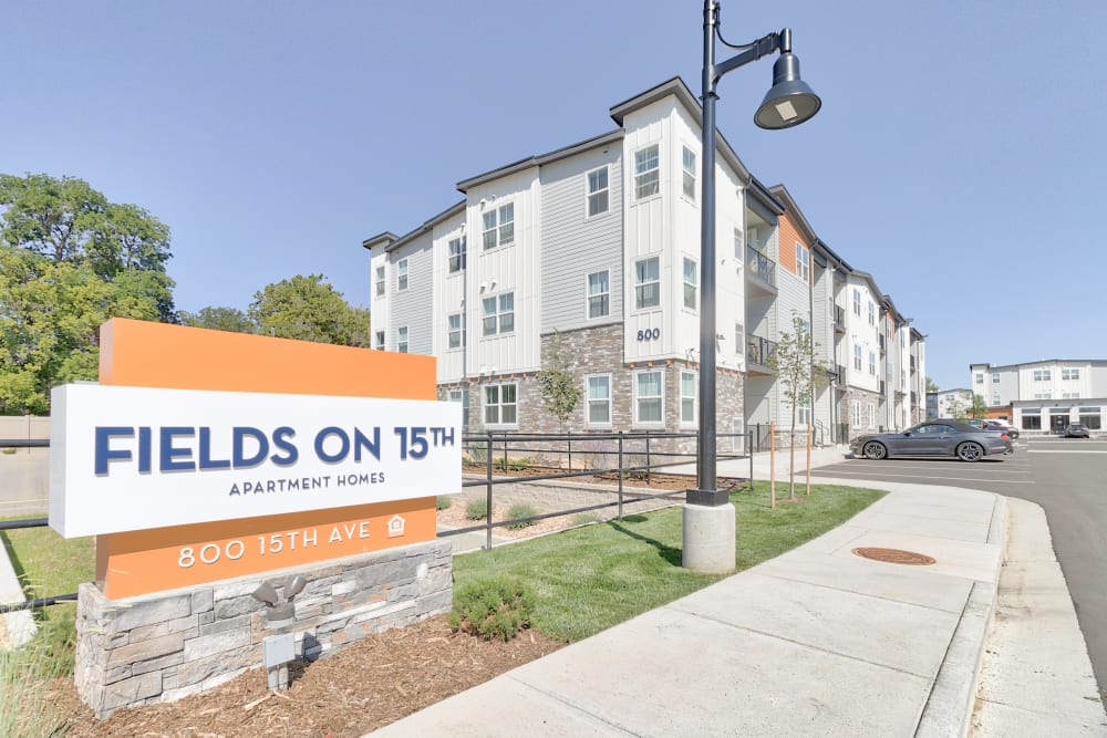 Community entrance and signage for Fields on 15th Apartment Homes in Longmont, Colorado