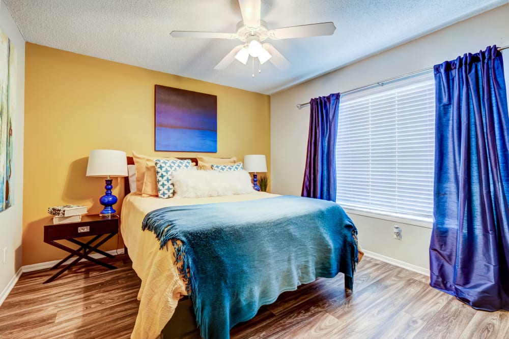 Spacious bedroom with bright colors at Hampton Greene Apartment Homes in Columbia, South Carolina