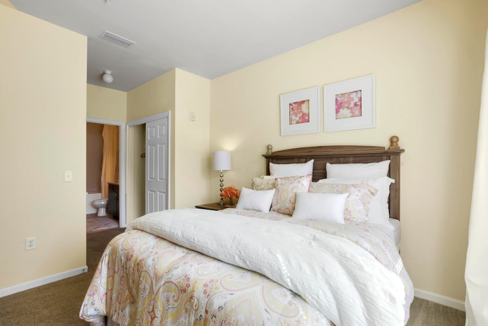 Brightly lit model bedroom at Courtney Isles in Yulee, Florida
