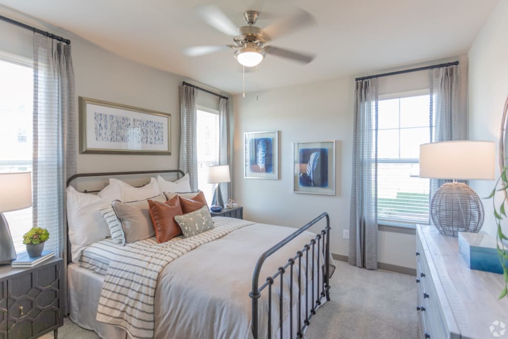 Model bedroom with lots of natural light at The Columns on Main in Spring Hill, Tennessee