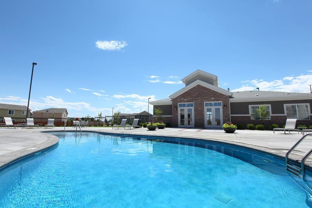 Resort style pool and lounge chairs at Outlook Ridge in Pueblo, Colorado