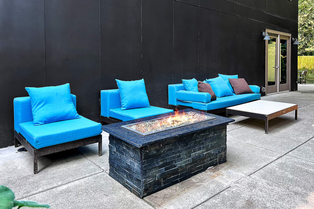 Fire pit lounge area at Karbon Apartments in Newcastle, Washington