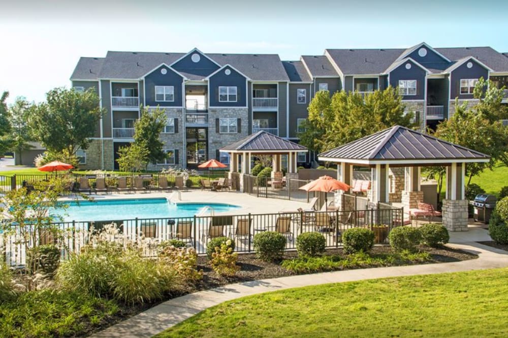 Exterior of the apartments and community pool at Providence Trail in Mt Juliet, Tennessee