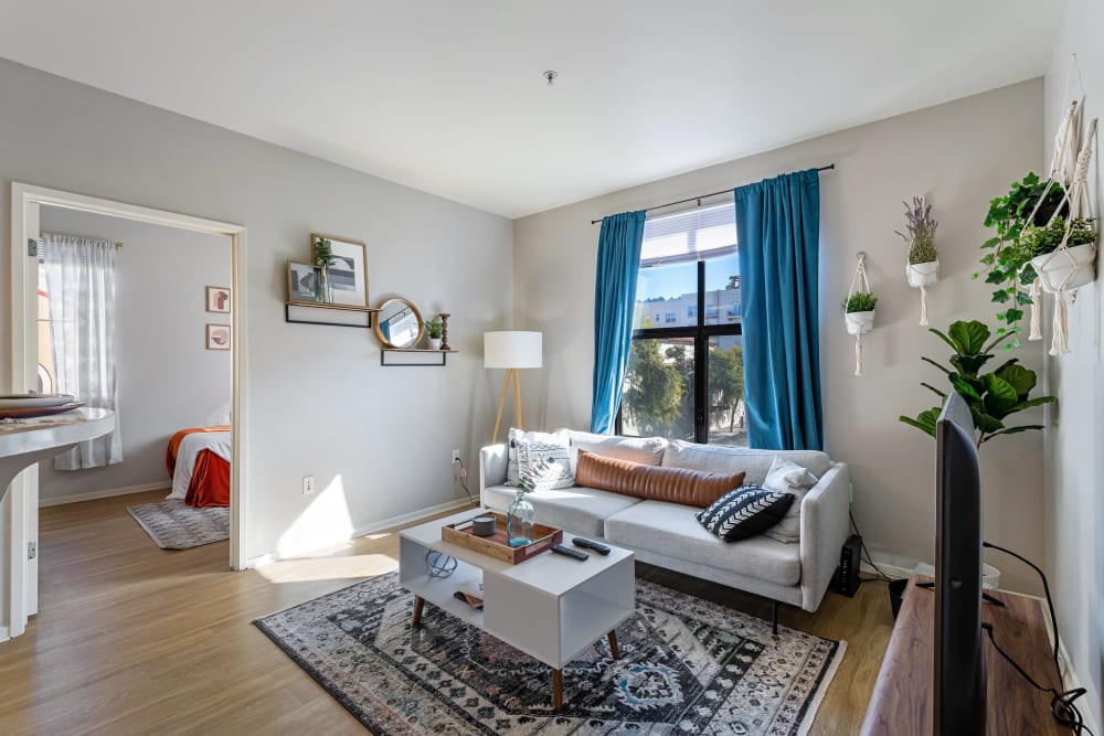 Colorful decor in the living area of a model home at K Street Flats Apartment Homes in Berkeley, California