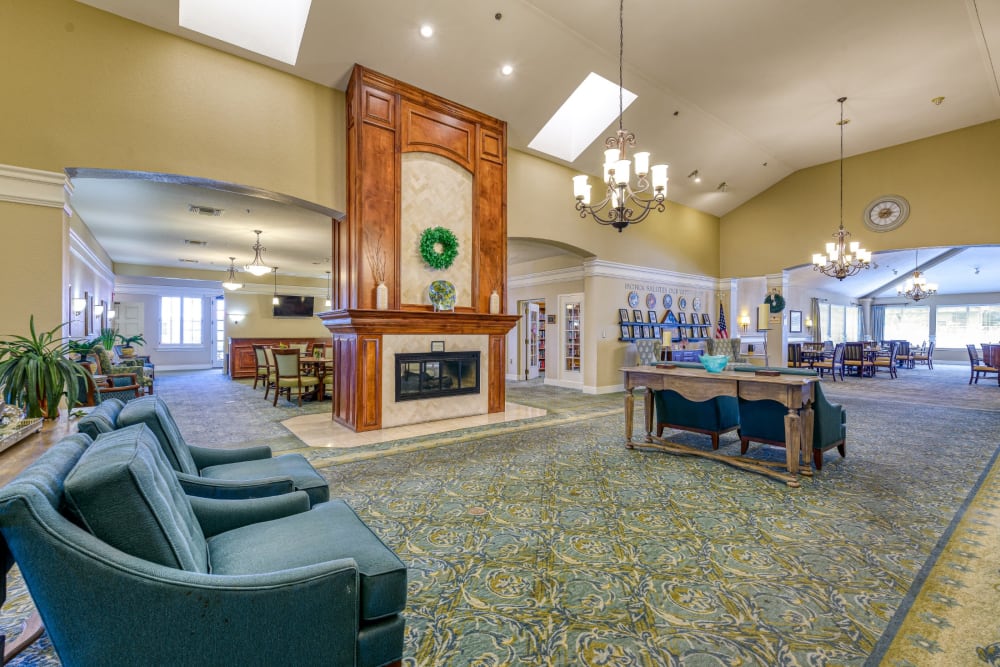 Lounge area with fireplace at Pacifica Senior Living Fresno in Fresno, California