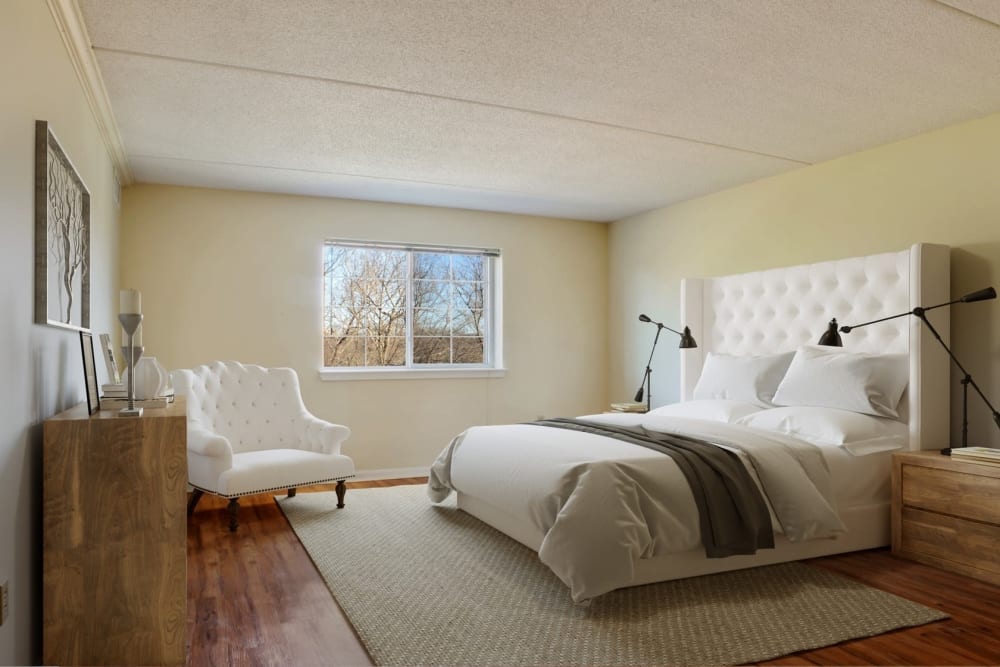 Bedroom with wood style flooring at Eagle Rock Apartments at Swampscott in Swampscott, Massachusetts