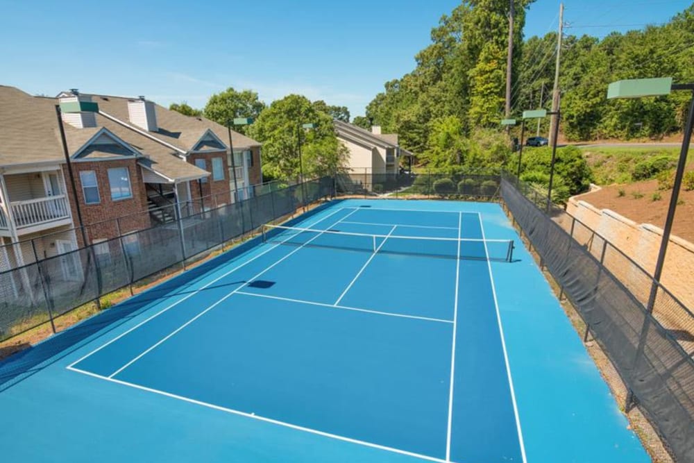 An outdoor tennis court for residents at Chace Lake Villas in Birmingham, Alabama