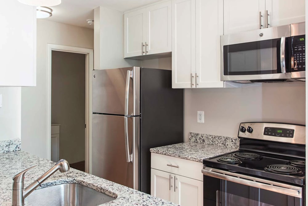 Stainless steel appliances in a model apartment kitchen at Hunt Club in Gaithersburg, Maryland