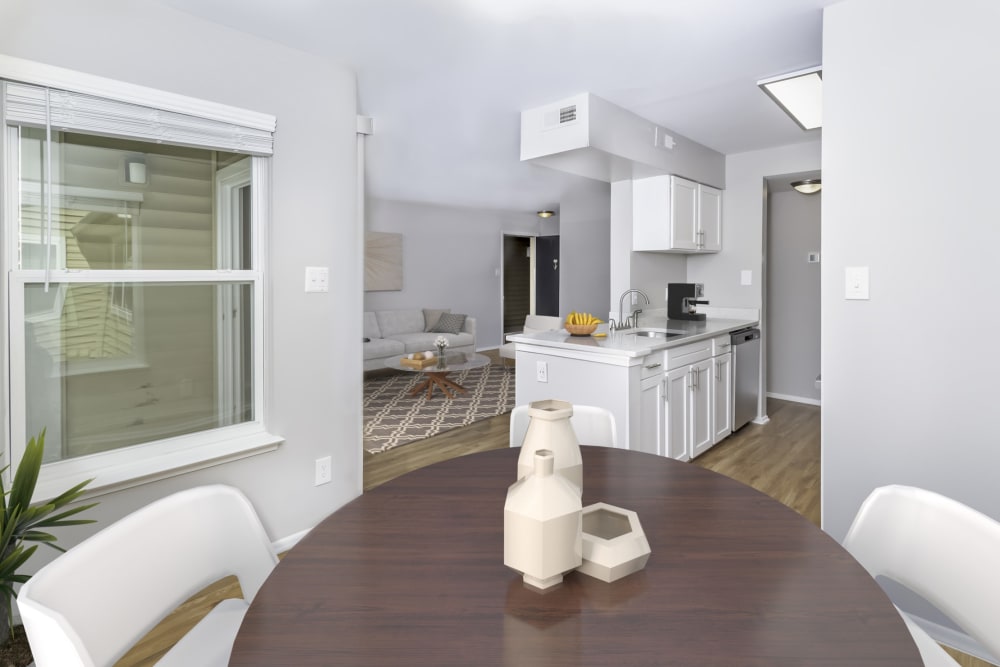 An apartment dining room, kitchen and living room at Springwoods at Lake Ridge in Woodbridge, Virginia