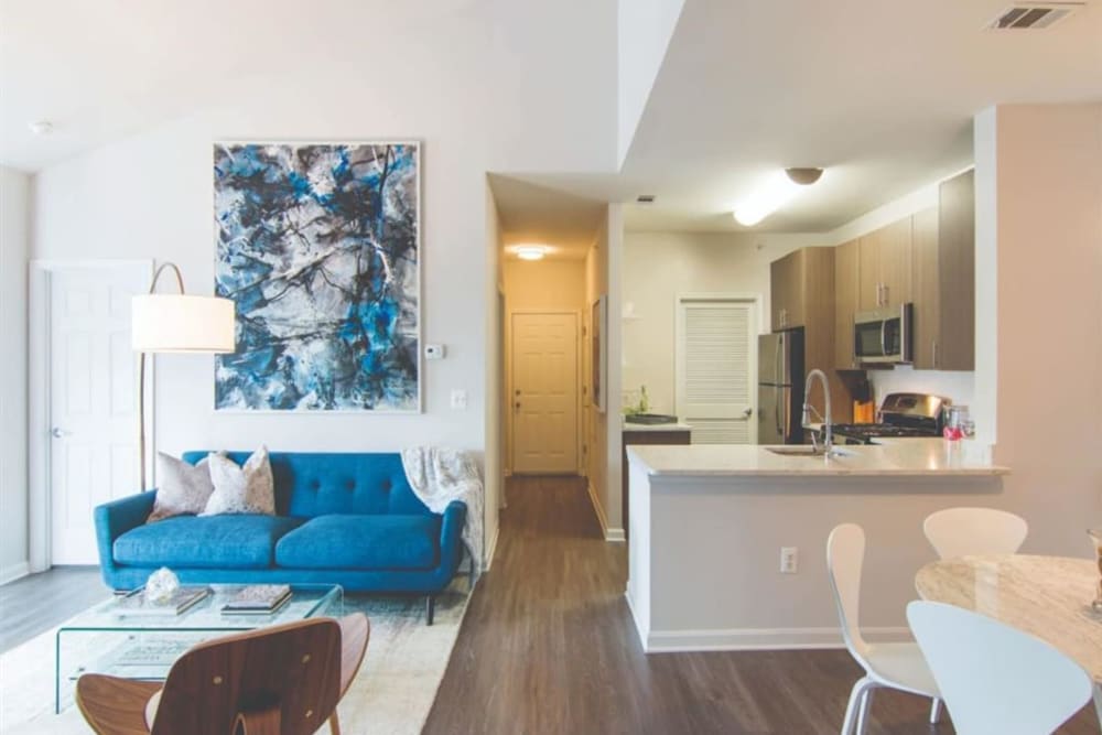 Furnished apartment living room next to the kitchen at Park at Kingsview Village in Germantown, Maryland