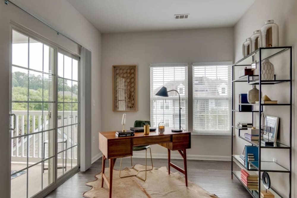 A computer and home office space in an apartment at Park at Kingsview Village in Germantown, Maryland