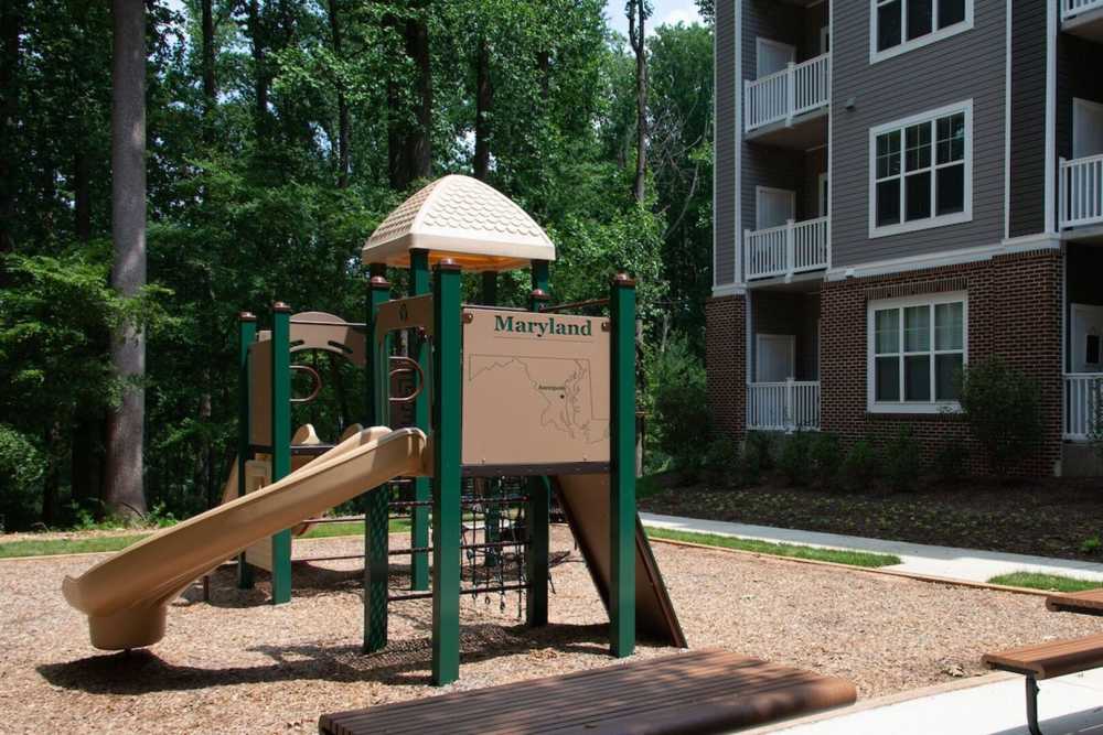 Kids play area with slides at The Elms at Century in Germantown, Maryland