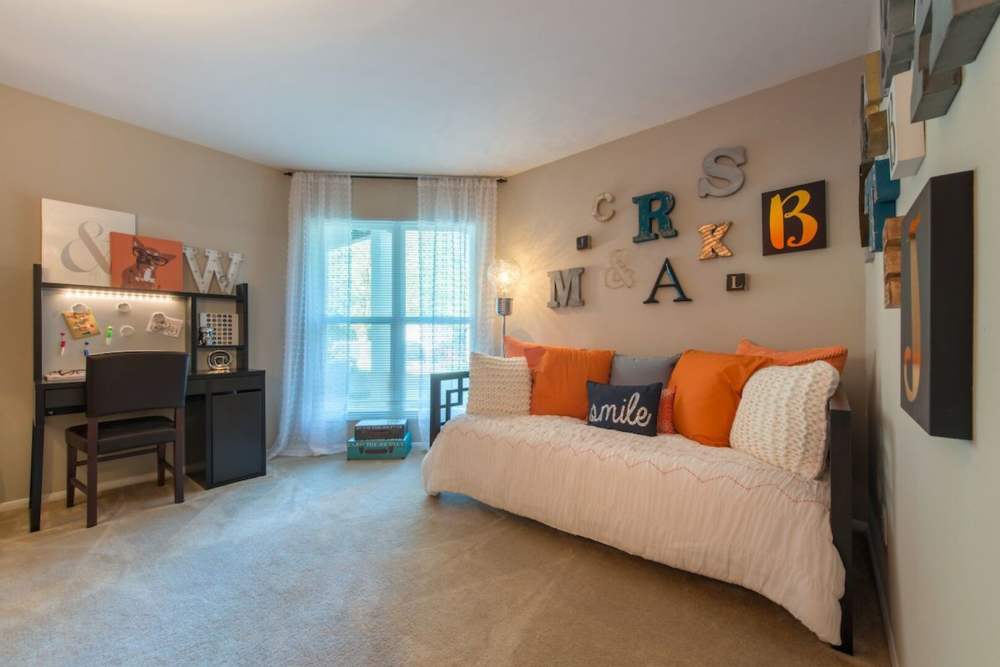 Well-planned living room with sofa at The Elms at Falls Run in Ellicott City, Maryland