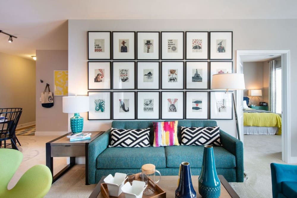 Living space with a couch and coffee table at The Elms at Arcola in Dulles, Virginia