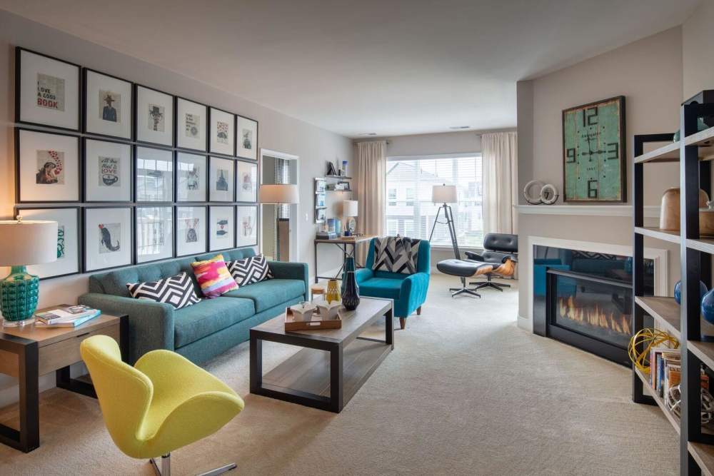 Living space with a fireplace at The Elms at Arcola in Dulles, Virginia