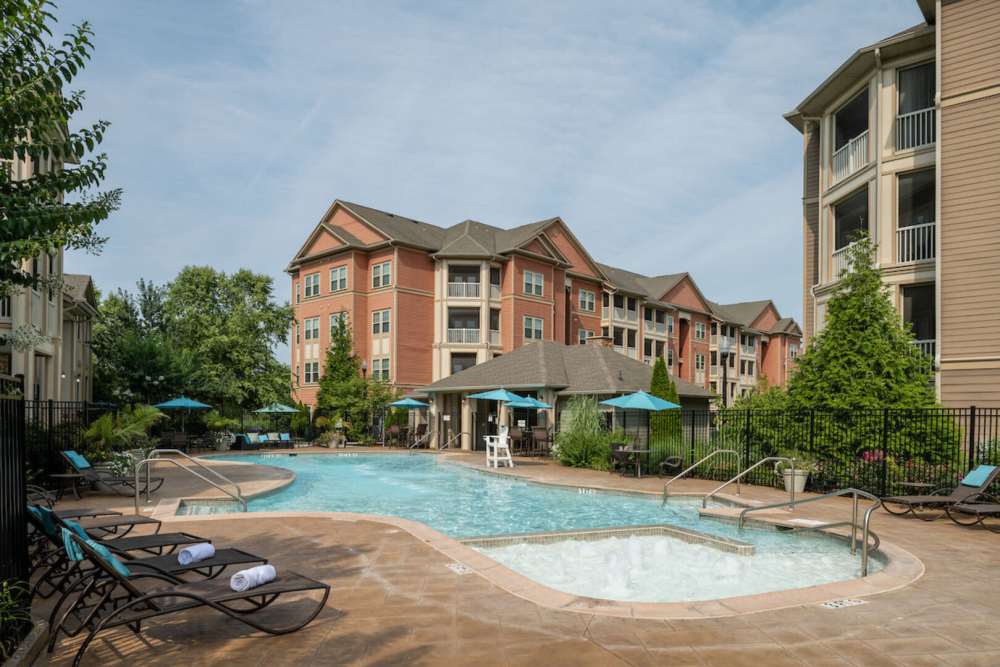 Saltwater pool with building view at The Elms at Odenton in Odenton, Maryland