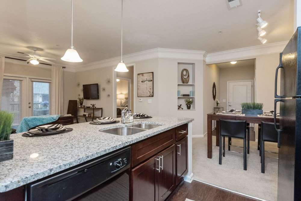 Hardwood kitchen with dining view at The Elms at Odenton in Odenton, Maryland