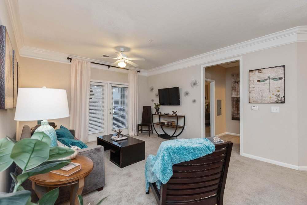 Crown molding living with big patio door view at The Elms at Odenton in Odenton, Maryland