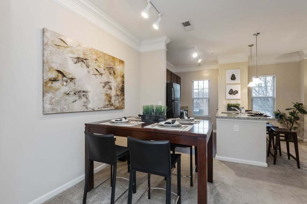 carpet flooring dining with kitchen view at The Elms at Odenton in Odenton, Maryland