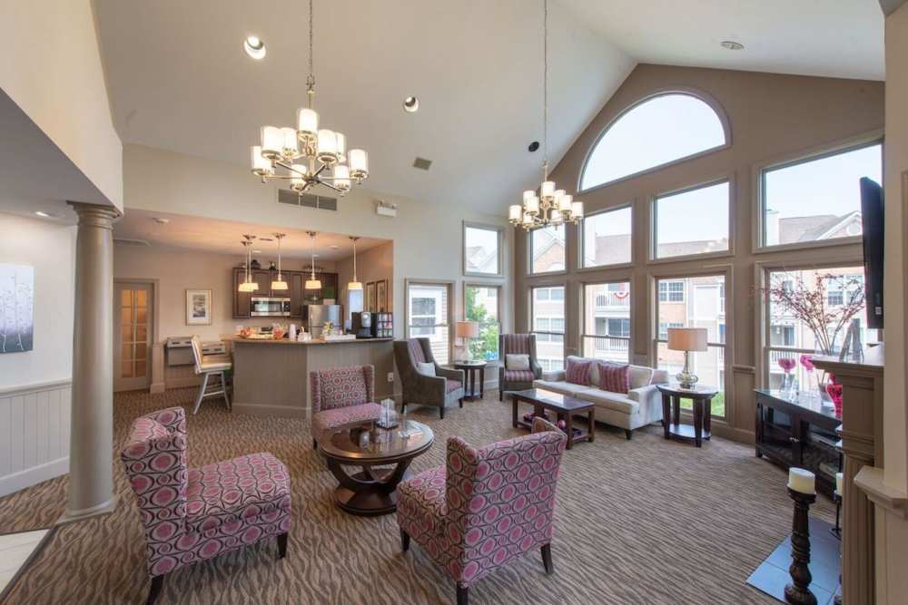 Resident lounge with lots of seating and flat screen TVs at The Elms at Centreville in Centreville, Virginia, 