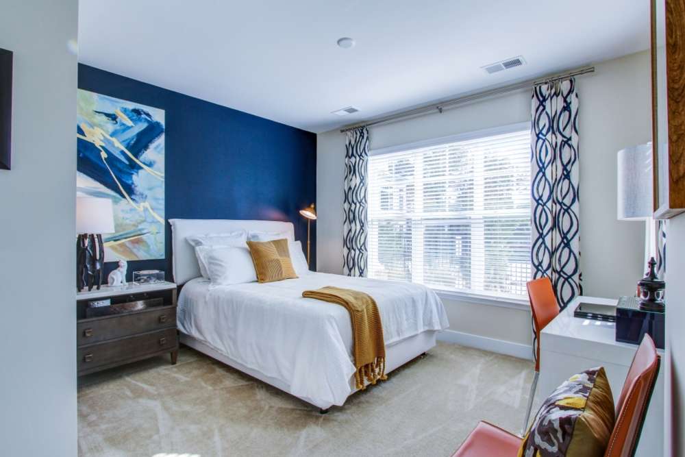 Bedroom with bright sun light at The Elms at Shannon's Glen in Jessup, Maryland
