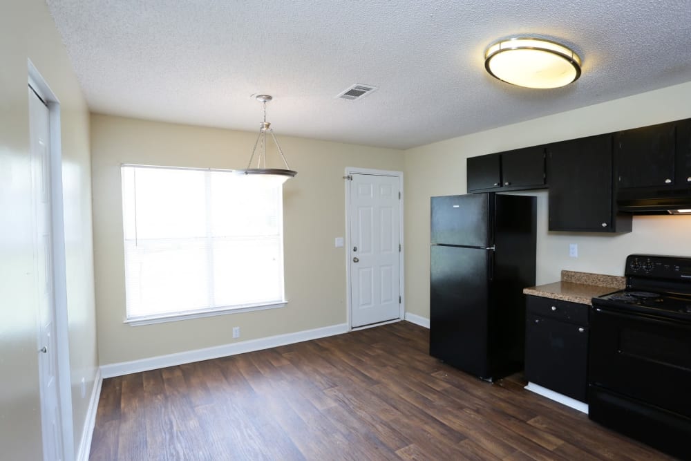 Kitchen with black cabinets at Madison Pines Apartment Homes in Madison, Alabama
