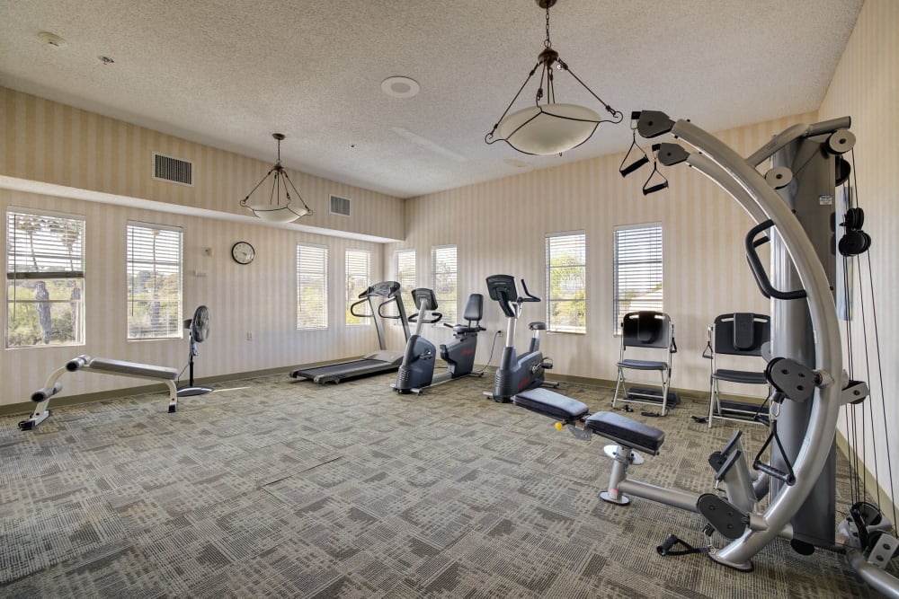 Fitness room with various workout equipment at Pacifica Senior Living Bonita in Chula Vista, California