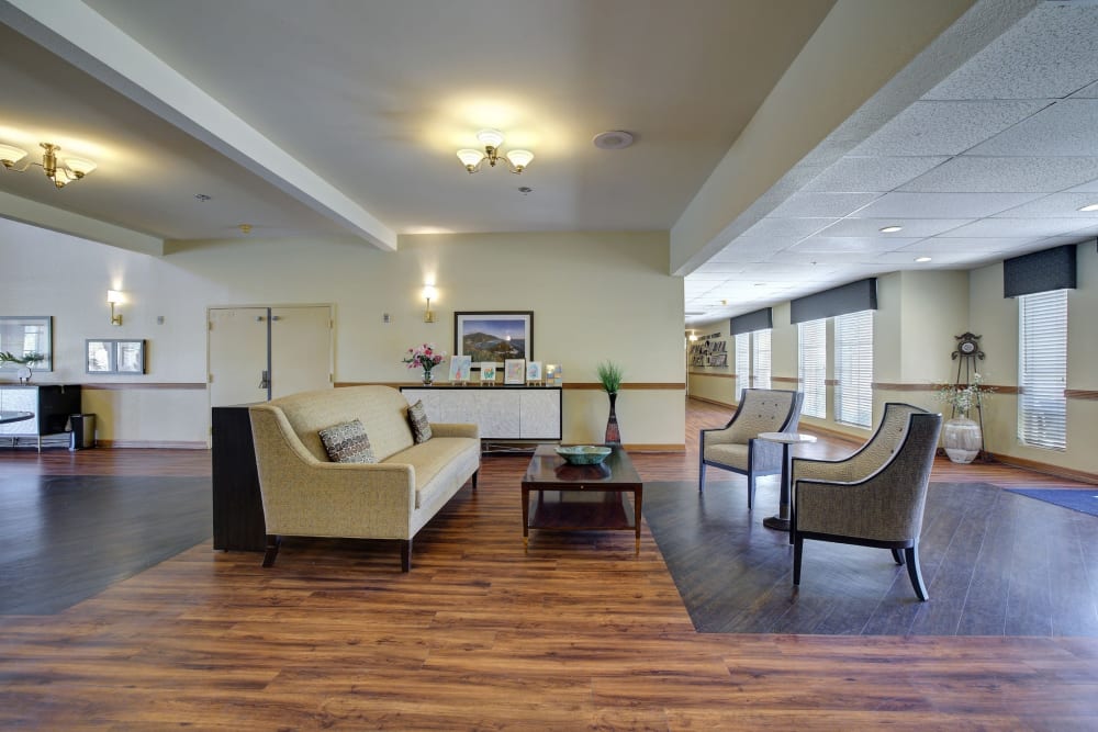 Lounge area with couch and arm chairs at Pacifica Senior Living Bonita in Chula Vista, California